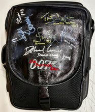 Load image into Gallery viewer, JAMES BOND - Sean Connery, Roger Moore, Timothy Dalton, Pierce Brosnan, Daniel Craig & George Lazenby Signed Crew Bag & Photo/Cards Display