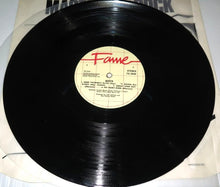 Load image into Gallery viewer, Rolling Stone magazine page signed by all Queen members