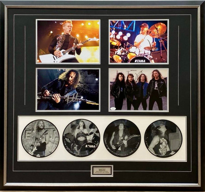 Metallica signed photos and picture discs display.