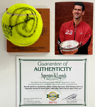 Load image into Gallery viewer, NOVAK DJOKOVIC Signed &amp; Authentic Used Tennis Ball from 2023 Roland Garros on Official Base
