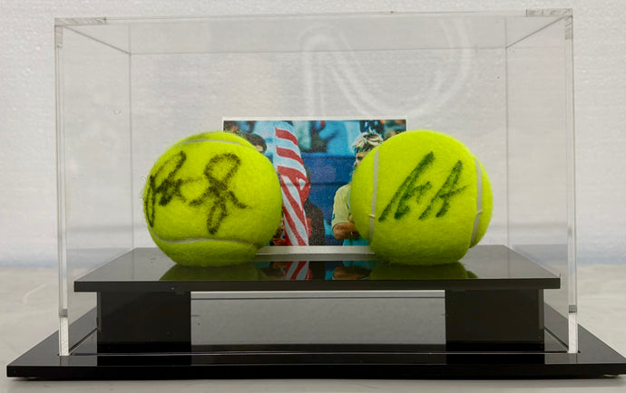 Signed tennis balls by Sampras and Agassi