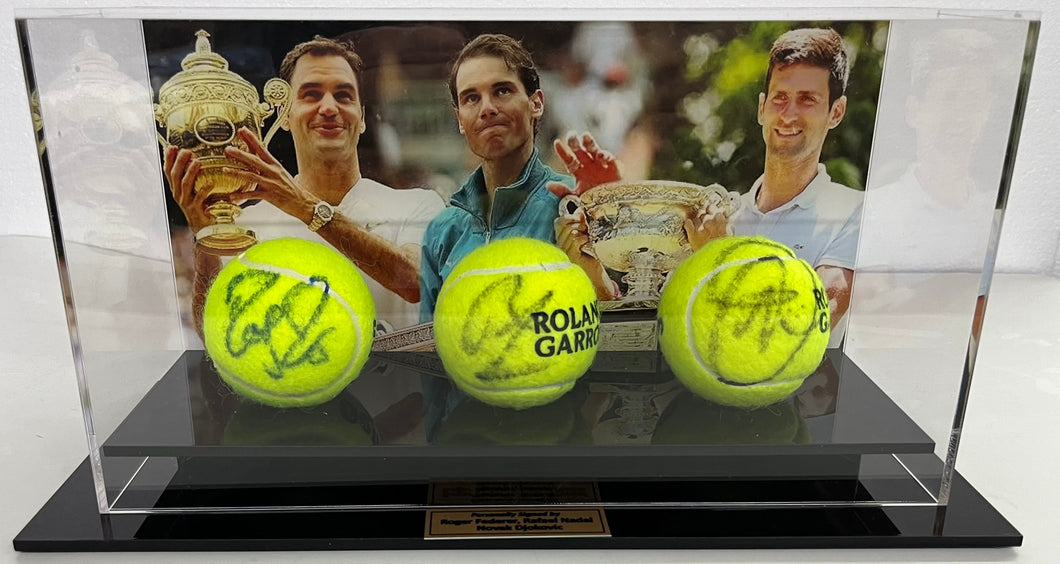 Close-up of Federer, Nadal, Djokovic signed tennis balls