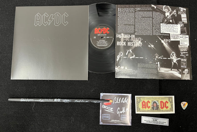 AC/DC signed drumstick and Back in Black LP display