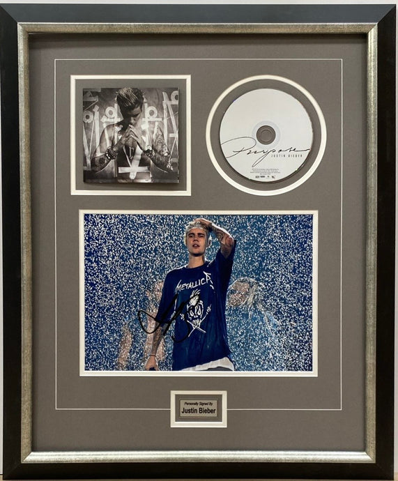 Justin Bieber signed photo and CD display