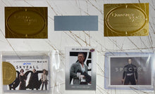Load image into Gallery viewer, JAMES BOND - Sean Connery, Roger Moore, Timothy Dalton, Pierce Brosnan, Daniel Craig &amp; George Lazenby Signed Crew Bag &amp; Photo/Cards Display
