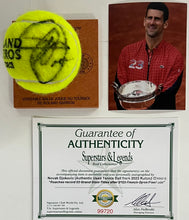 Load image into Gallery viewer, NOVAK DJOKOVIC Signed &amp; Authentic Used Tennis Ball from 2023 Roland Garros on Official Base
