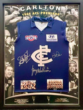 Load image into Gallery viewer, STEPHEN KERNAHAN, GREG WILLIAMS &amp; DAVID PARKIN Signed 1995 AFL Premiers Jumper Display2
