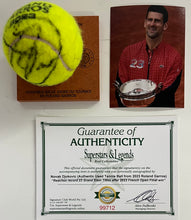 Load image into Gallery viewer, NOVAK DJOKOVIC Signed &amp; Authentic Used Tennis Ball from 2023 Roland Garros on Official Base
