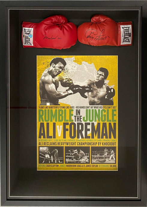 Muhammad Ali and George Foreman signed boxing gloves, framed