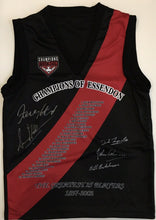 Load image into Gallery viewer, Unframed JAMES HIRD &amp; SIMON MADDEN Signed “Greatest 25 Players 1897-2002” Essendon Jumper
