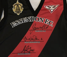 Load image into Gallery viewer, Unframed JAMES HIRD, GAVIN WANGANEEN &amp; GRAHAM MOSS Signed “Brownlow Medallists” Signed Essendon Jumper
